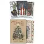 Yuletide Tarot box by Kristoffer Hughes with art by Erin O'Leary Brown showing a candlelit tree and a striped sleeve, beside winter cards titled Sinterklaas and Mistletoe and a wreath on a door