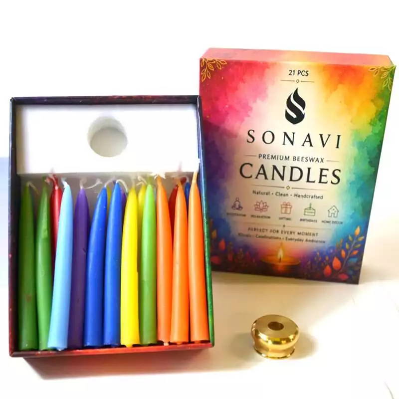 set-of-21-3quot-7-Colors-beeswax-meditation-candles-CSB3SET02 Open box of 21 assorted-color beeswax taper candles with white wicks beside the printed box lid reading Premium Beeswax Candles and a small brass candle holder