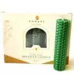 Green hand-rolled beeswax candle with a honeycomb surface and a visible seam down one side, standing in front of its cream box marked Natural Beeswax Hand Roll Beeswax Candle, Pack of 5