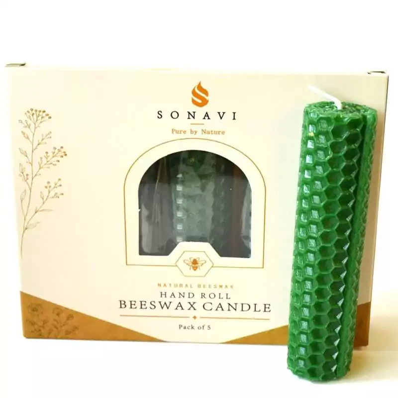 Green hand-rolled beeswax candle with a honeycomb surface and a visible seam down one side, standing in front of its cream box marked Natural Beeswax Hand Roll Beeswax Candle, Pack of 5