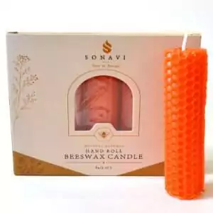 Bright orange hand-rolled honeycomb beeswax candle with a white wick, standing beside its cream box marked Natural Beeswax Hand Roll Beeswax Candle, Pack of 5