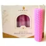 Soft pink hand-rolled honeycomb beeswax candle with a white wick, standing in front of its cream box marked Natural Beeswax Hand Roll Beeswax Candle, Pack of 5