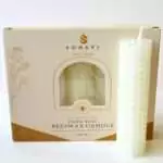 Creamy white hand-rolled honeycomb beeswax candle with a white wick, standing in front of its cream box marked Natural Beeswax Hand Roll Beeswax Candle, Pack of 5