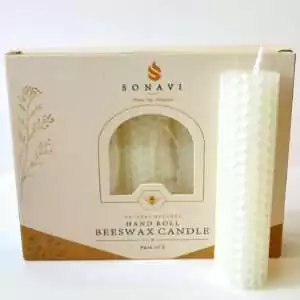Creamy white hand-rolled honeycomb beeswax candle with a white wick, standing in front of its cream box marked Natural Beeswax Hand Roll Beeswax Candle, Pack of 5