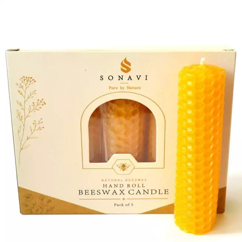 Golden yellow hand-rolled honeycomb beeswax candle with a short white wick, standing in front of its cream box marked Natural Beeswax Hand Roll Beeswax Candle, Pack of 5