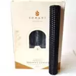 Black 8 inch hand-rolled honeycomb beeswax candle with a white wick standing in front of its cream box marked Natural Beeswax Hand Roll Beeswax Candle, Pack of 5