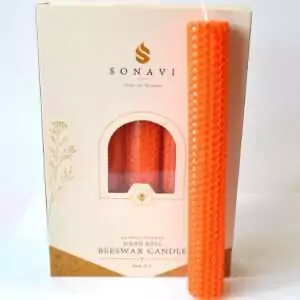 Bright orange 8 inch hand-rolled honeycomb beeswax candle with a white wick standing in front of its cream box marked Natural Beeswax Hand Roll Beeswax Candle, Pack of 5