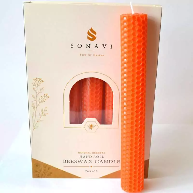 set-of-5-8quot-Orange-beeswax-candles-CSB8O Bright orange 8 inch hand-rolled honeycomb beeswax candle with a white wick standing in front of its cream box marked Natural Beeswax Hand Roll Beeswax Candle, Pack of 5