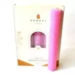 Soft pink 8 inch hand-rolled honeycomb beeswax candle with a white wick standing in front of its cream box marked Natural Beeswax Hand Roll Beeswax Candle, Pack of 5