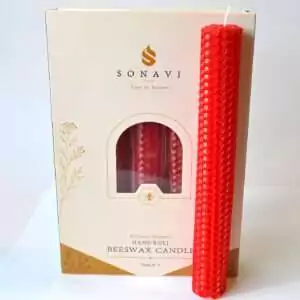 Vivid red 8 inch hand-rolled honeycomb beeswax candle with a white wick standing in front of its cream box marked Natural Beeswax Hand Roll Beeswax Candle, Pack of 5
