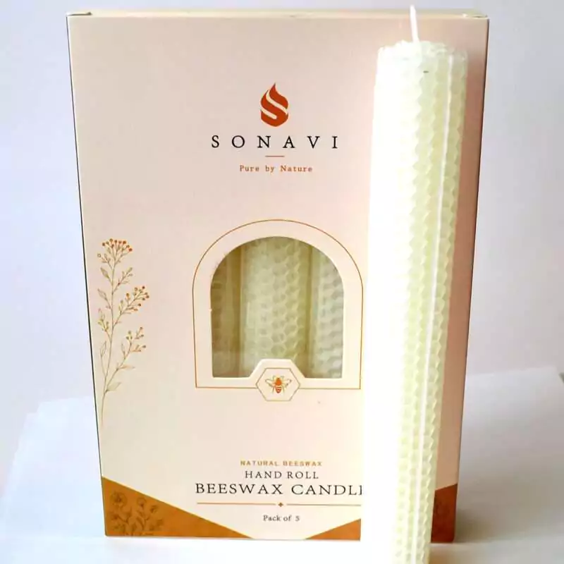 set-of-5-8quot-White-beeswax-candles-CSB8W Cream-white 8 inch hand-rolled honeycomb beeswax candle with a white wick standing in front of its cream box marked Natural Beeswax Hand Roll Beeswax Candle, Pack of 5
