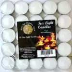 Tray of 50 white candles in metal cups wrapped in clear film, each with a rounded top and a white wick, with a pack label reading Tea Light Candles and 50 Tea Light Candles