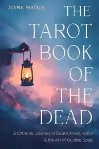 Cover of The Tarot Book of the Dead by Jenna Matlin, showing a hand holding a lit lantern against blue and pink watercolor-style clouds, with the subtitle about death, mediumship and guiding souls